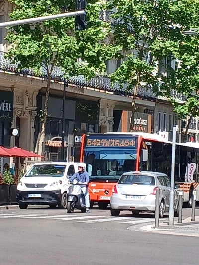 A bus with glitched screen on top displaying the line number
